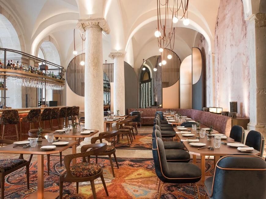 Arched restaurant dining room with banquette seating